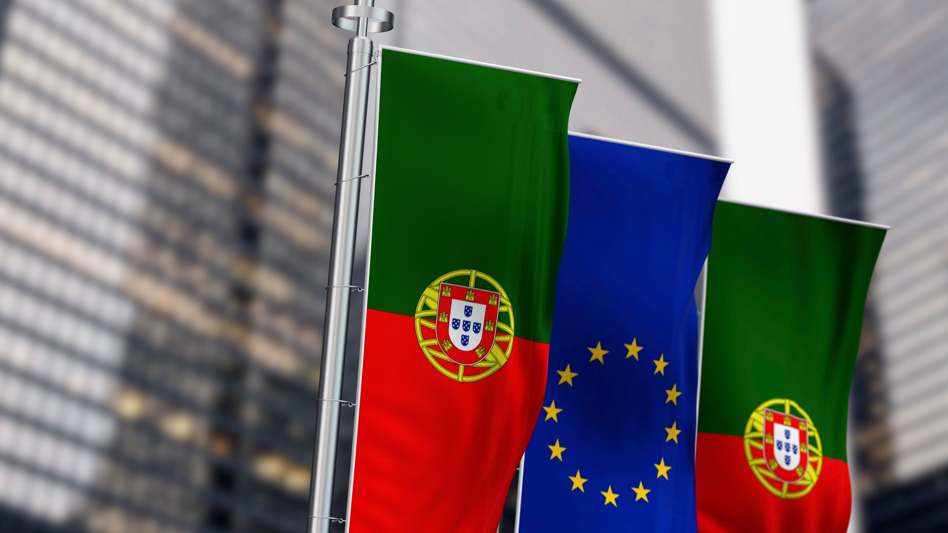 Close-up of Portugal and the European Union vertical flags waving in the wind